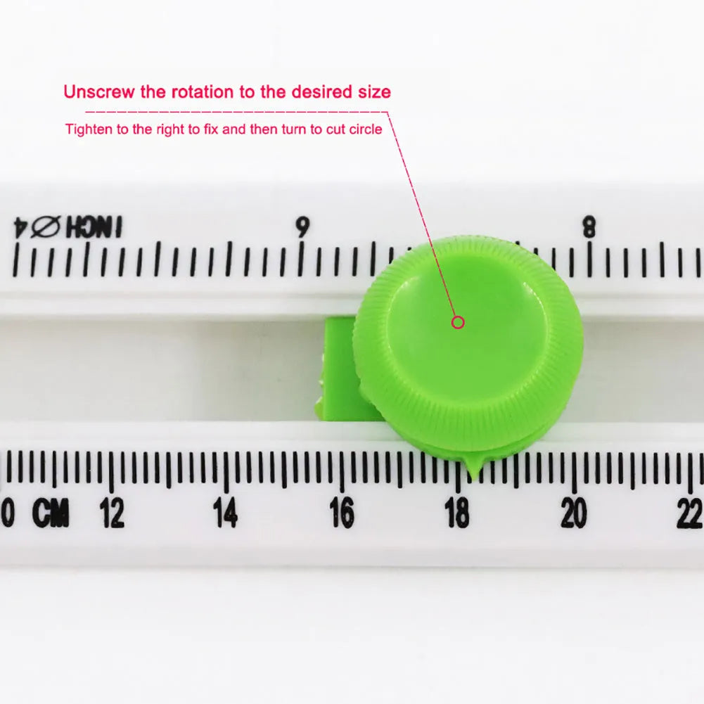 Green and orange plastic A3 round paper cutter on a colour box.