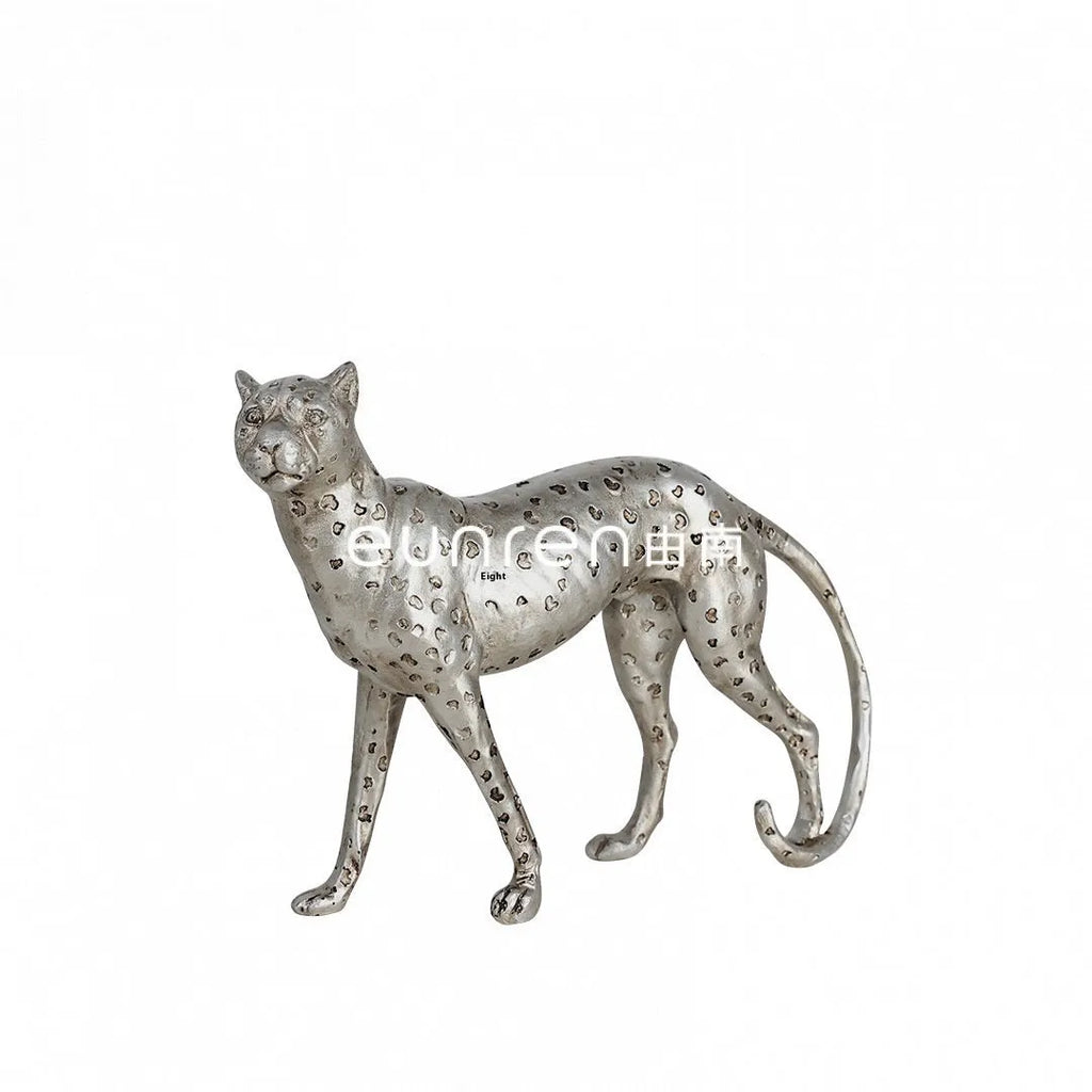 Leopard-shaped resin home ornament in American Leopard colour on wooden surface