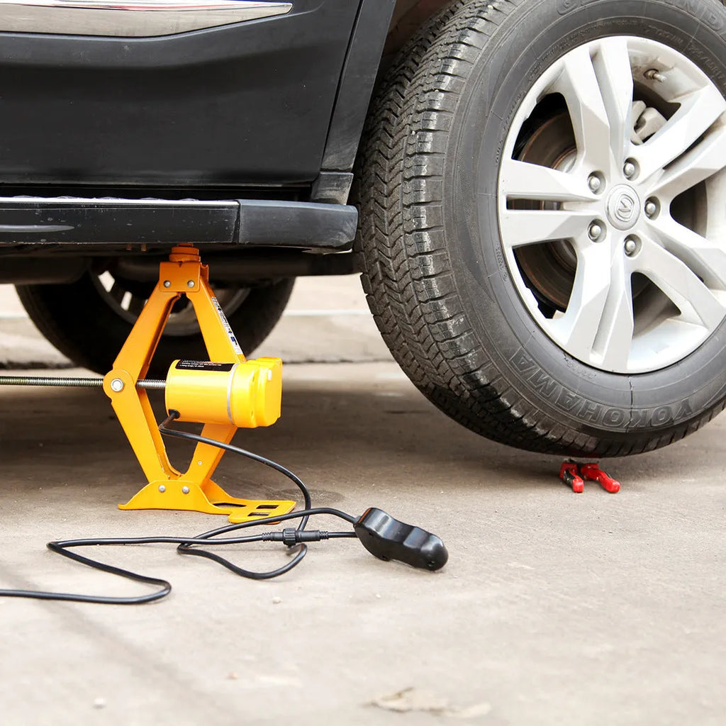 Electric hydraulic vehicle jack kit with 2 tonne capacity mounted in car for roadside assistance