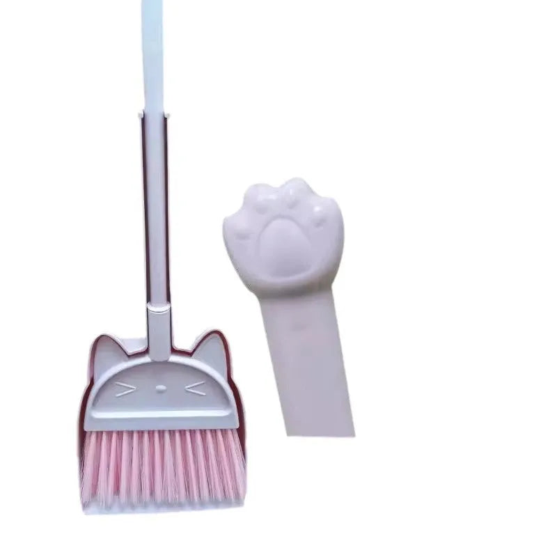 Purple plastic broom and dustpan set showing broom stored upright in the dustpan's handle holder.