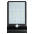IP65-rated outdoor solar garden light with LED illumination in black or white colour options