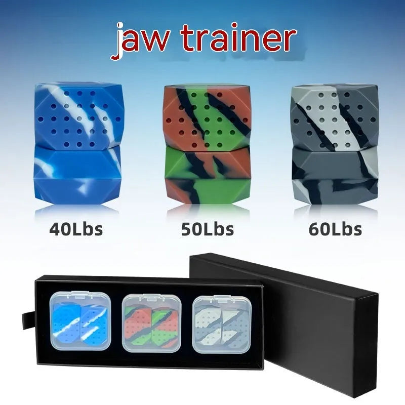 Two camouflage-pattern silicone facial muscle fitness balls for jawline training in a transparent box.