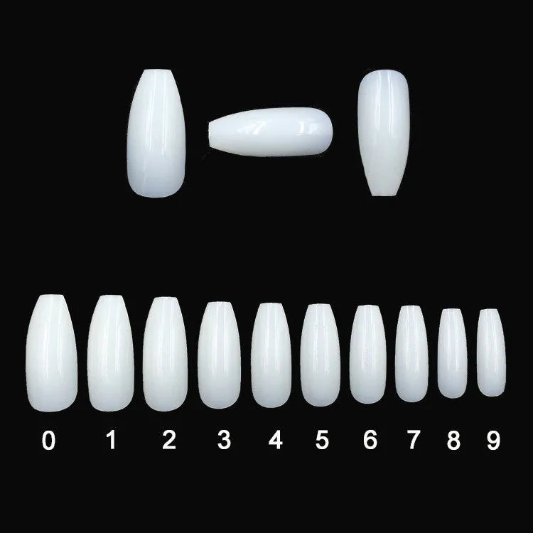 500 clear and natural ABS acrylic false nails in 10 sizes spread on a table
