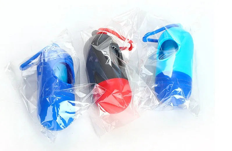 Roll of coloured dog waste bags showing black, blue, green, and pink options