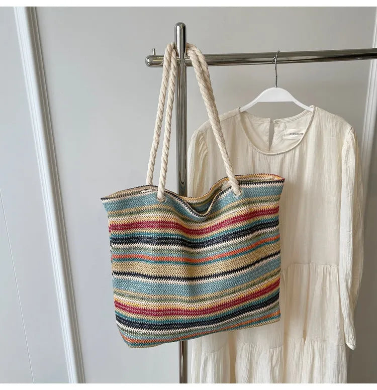 Blue nylon woven shoulder bag with large capacity and polyester lining shown against a neutral background