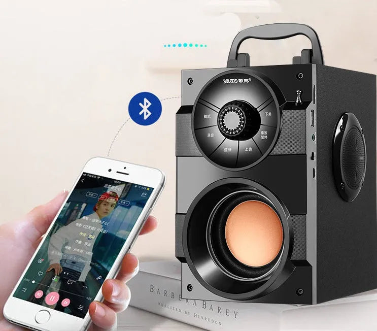 Black portable audio system with subwoofer, USB cable, and 3.5mm audio connection cable