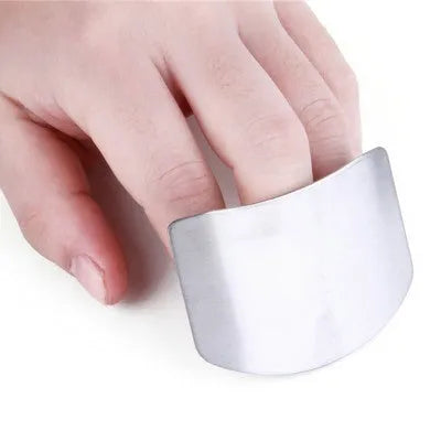 Stainless steel hand guard for finger protection during vegetable cutting.