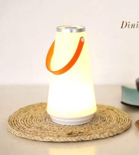 White rechargeable bedside table lamp with USB charging cable and touch control for adjustable brightness