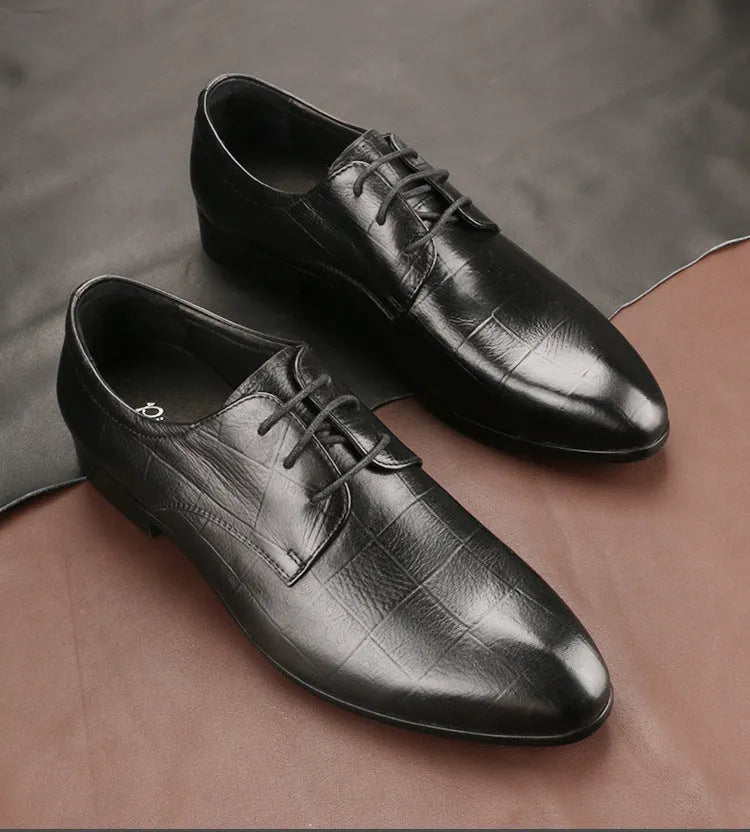 Men's black leather derby shoes with pointed toe, checkered sewing detail, and a rubber sole.
