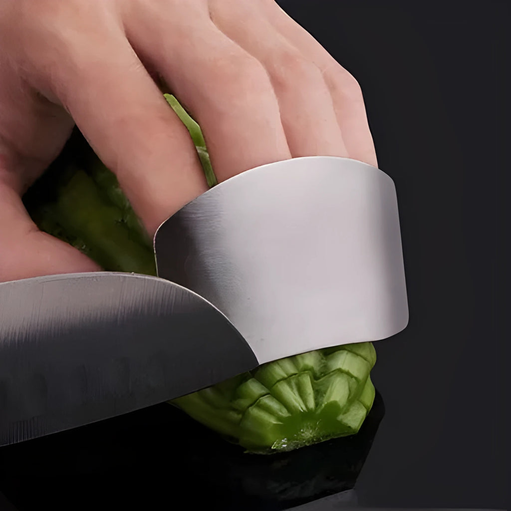 Stainless steel hand guard for finger protection during vegetable cutting.