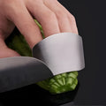 Stainless steel hand guard for finger protection during vegetable cutting.