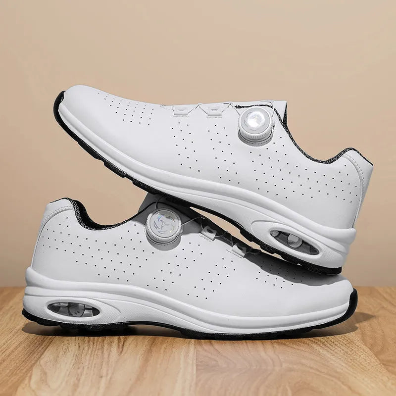 Women's black mesh low-top casual trainers with white cross-straps and a round toe, on a white background.