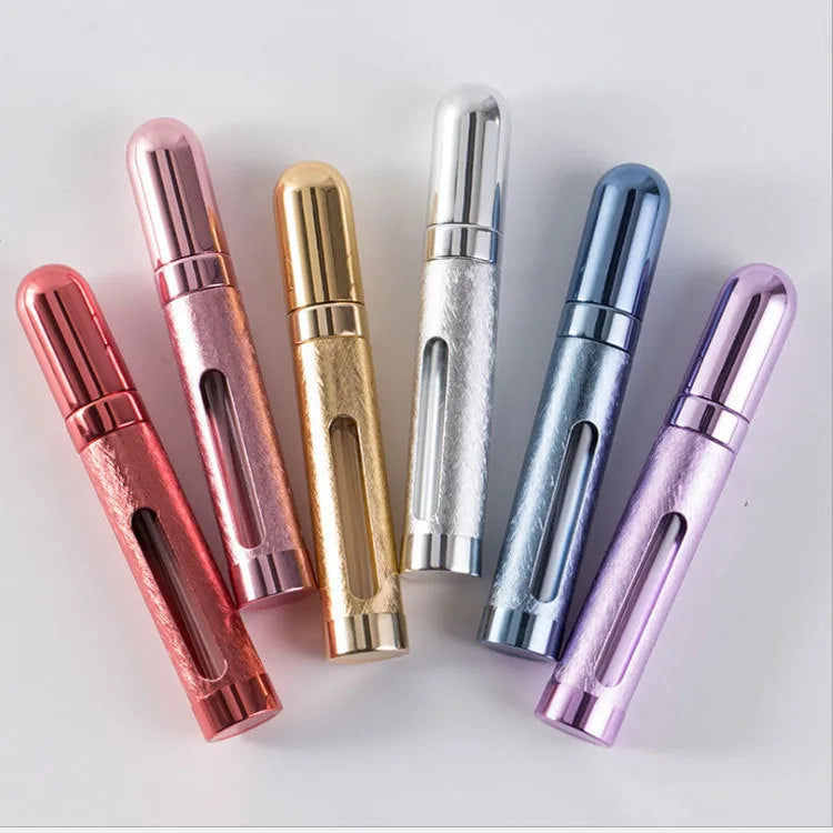 Slim 12ml aluminium travel perfume bottle with glass liner in choice of six colours including blue, gold, and pink.