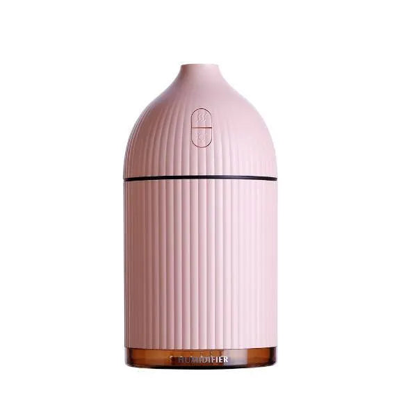White ultrasonic aromatherapy diffuser humidifier with LED light and 300ml water bottle.