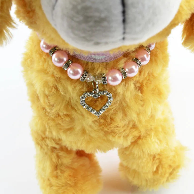 Pet pearl necklace with 10mm imitation pearls, 7mm rhinestone beads, alloy pendant, and white plated K detail