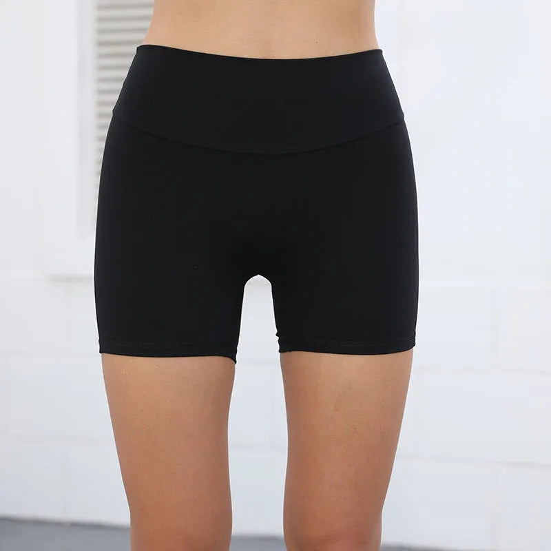 Women's high-waist fitness shorts in quick-dry nylon with side pockets, shown in Electric Blue.