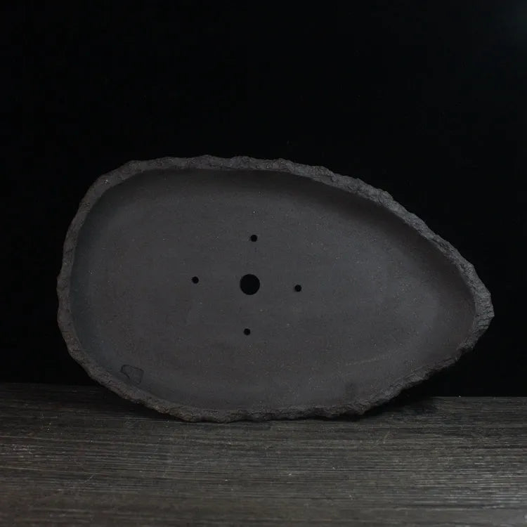 Handmade purple clay flower pot showing traditional craftsmanship and floor-standing design