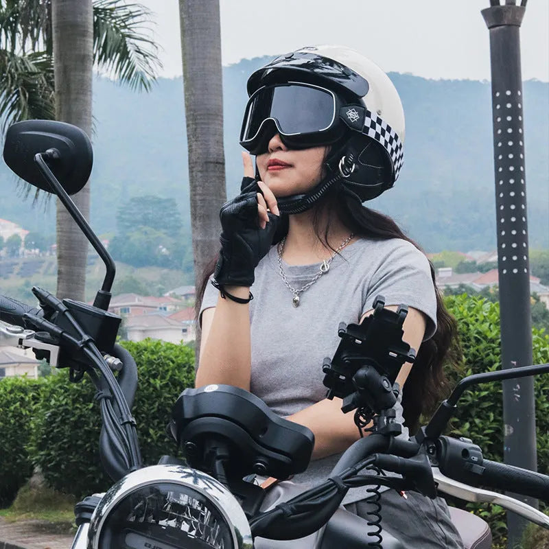 Retro style motorcycle helmet shown in cement grey colour on a solid background.