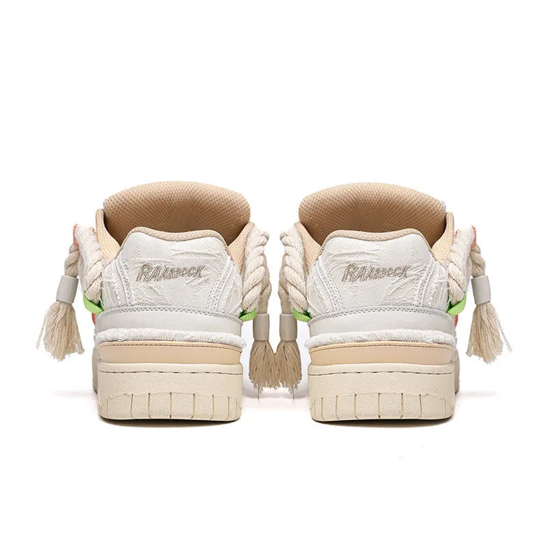 Creamy white old damage lace-up retro skateboard shoes with low-top round toe and platform sole.