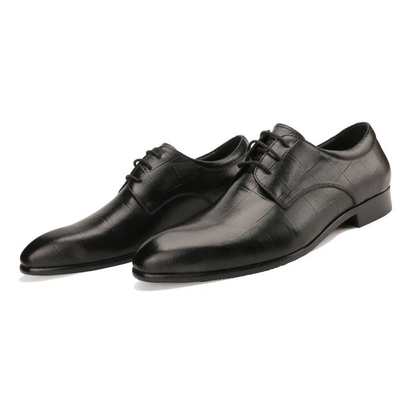 Men's black leather derby shoes with pointed toe, checkered sewing detail, and a rubber sole.