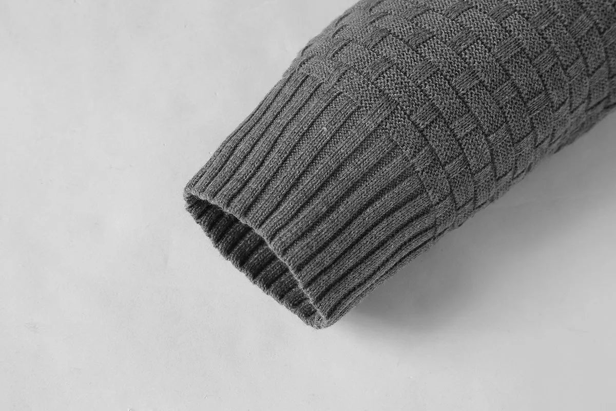 Men's black hooded sweatshirt made from cotton and polyester blend fabric on a grey background.