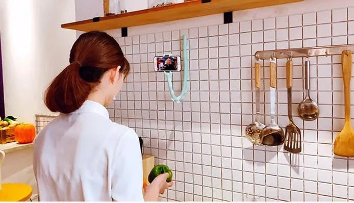 Flexible rubber phone bracket with suction cup showing 360° rotation capability