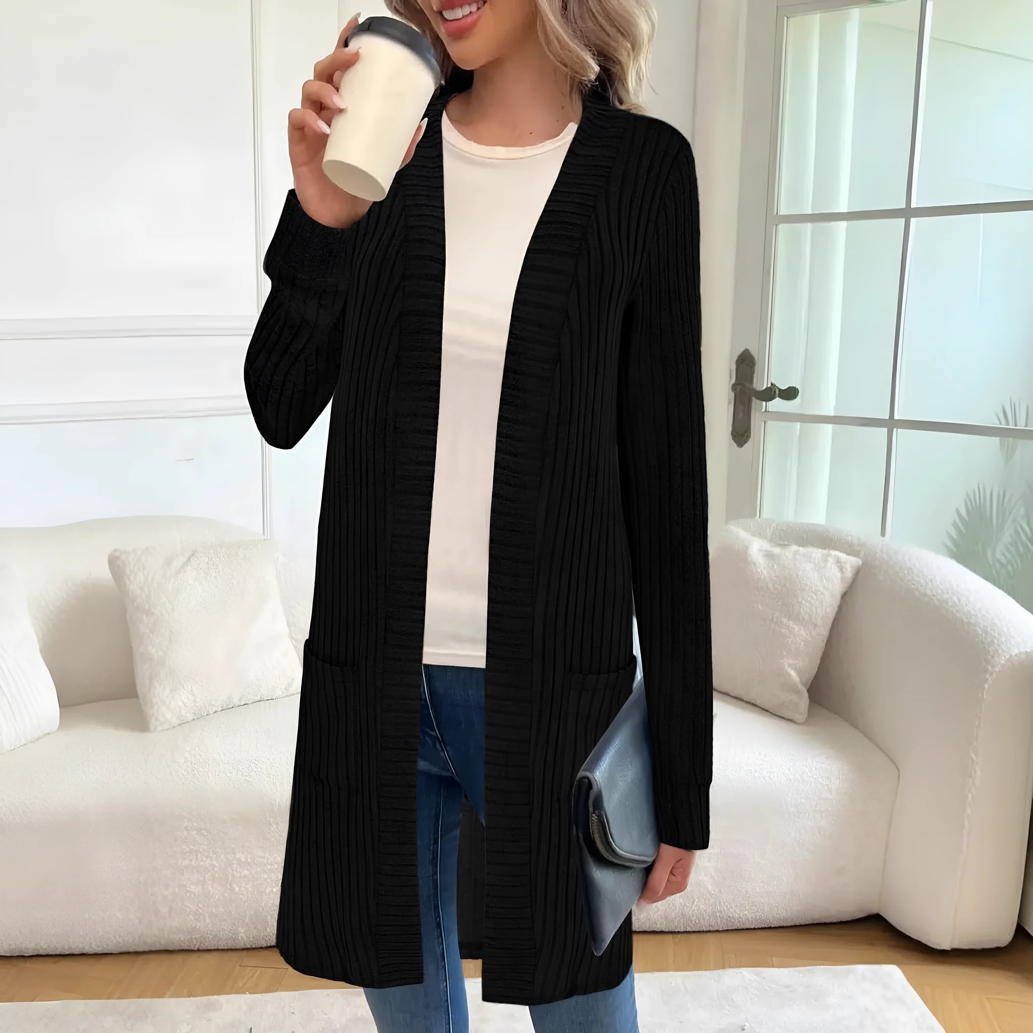 A loose-fit long sleeve knitted cardigan jacket in grey with front pockets.