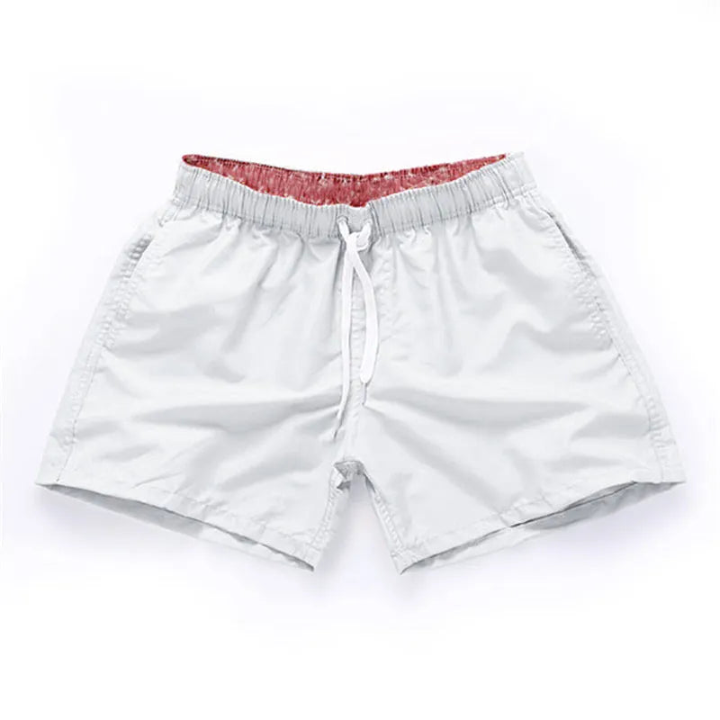 Men's straight leg beach shorts in polyester fabric available in multiple colours and sizes up to 4XL