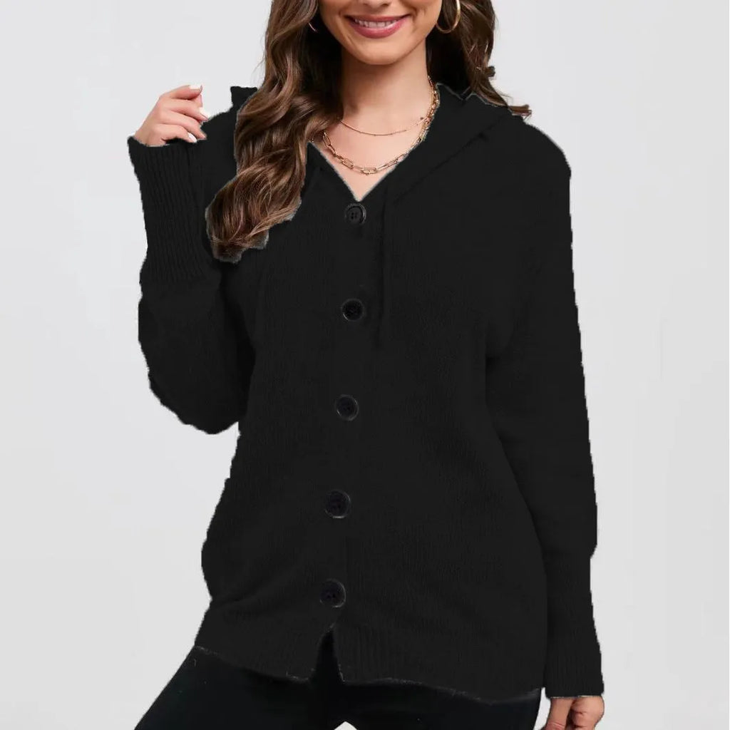 Woman wearing a loose-fit, thick cotton hooded cardigan sweater in a solid colour.