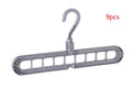 Plastic clothes hanger with rotating hook shown in pink, dimensions 33 cm long by 17 cm high