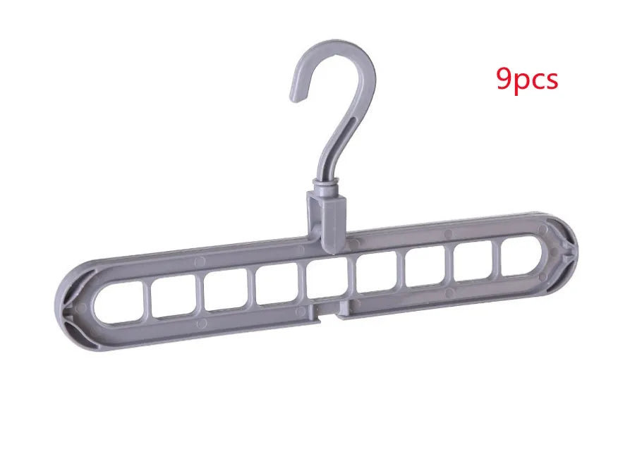 Plastic clothes hanger with rotating hook shown in pink, dimensions 33 cm long by 17 cm high