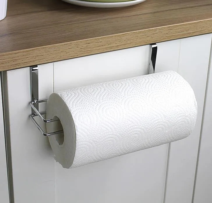 Silver stainless steel paper towel rack mounted on a cabinet door.