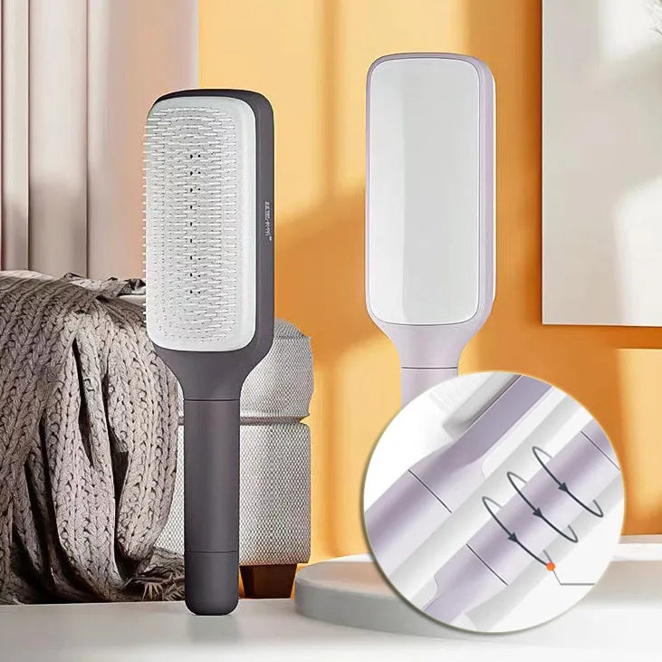 Roland purple self-cleaning hair brush with anti-static massage comb showing telescopic cleaning mechanism