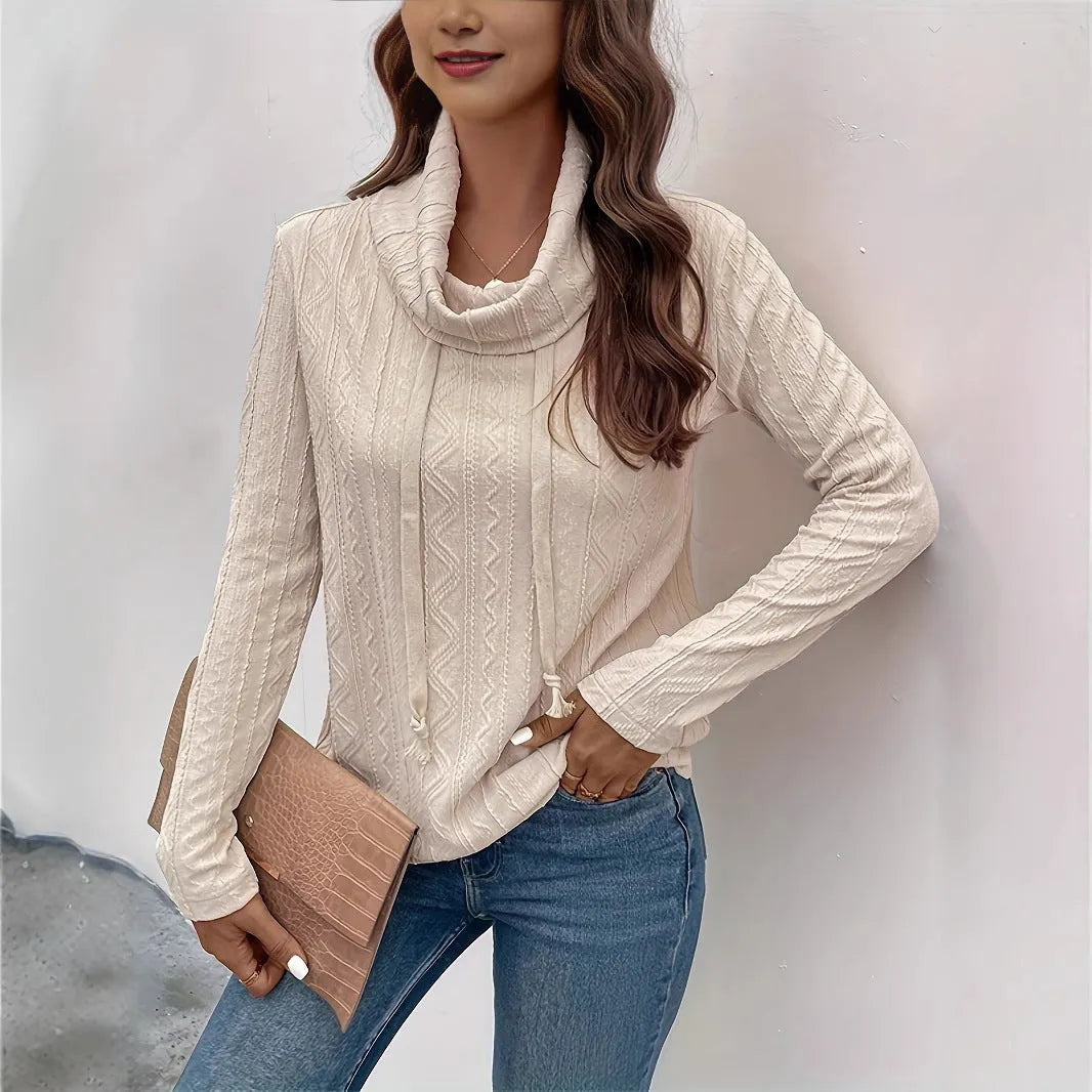 Apricot coloured long sleeve hooded pullover sweater with drawstring adjustment