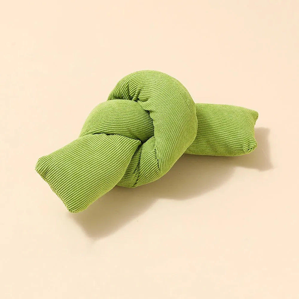 White knotted cotton rope dog toy for chewing and tug-of-war play.
