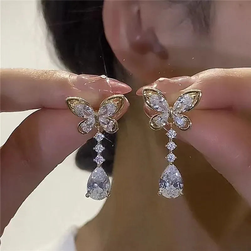 Women's platinum coloured bow stud earrings with electroplated finish on zinc alloy
