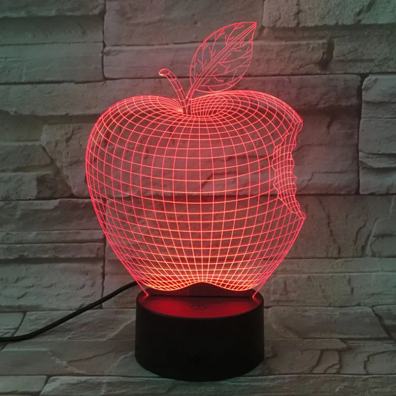 3D fruit-shaped colourful LED night light with touch control on a surface