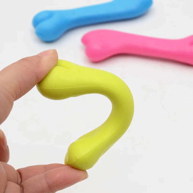 TPR rubber dog bone chew toy for puppies, 20g bite resistant molar toy in random blue, pink or yellow.