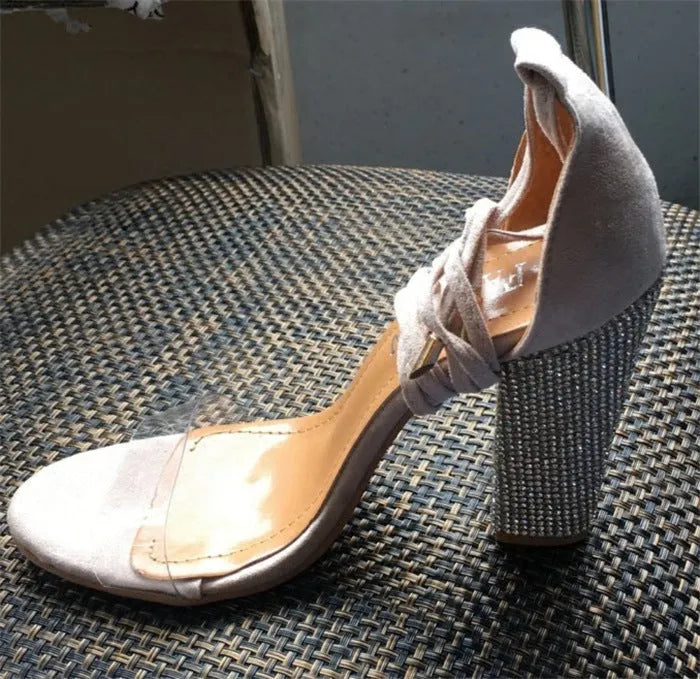 Black and gold plastic high heel shoes with pointed toe design