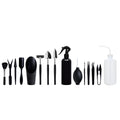 Black mini garden hand tools set including scissors, tweezers, shovels and spray bottle arranged on a cushion for succulent care