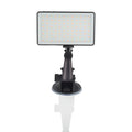 Black aluminium LED video conference light with 96 LEDs and a display screen, shown next to a laptop.