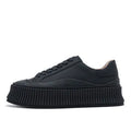Women's black suede platform sneakers with a thick sole and back lacing system.