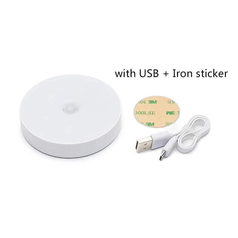White USB rechargeable motion sensing LED night light with adhesive backing and charging cable