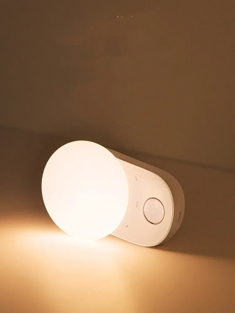 White Baseus Full Moon rechargeable night light with motion sensor for bedroom and aisle use