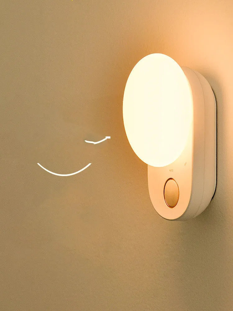 White Baseus Full Moon rechargeable night light with motion sensor for bedroom and aisle use