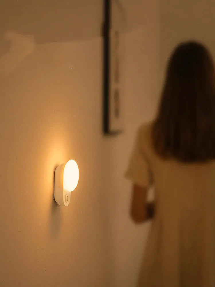 White Baseus Full Moon rechargeable night light with motion sensor for bedroom and aisle use