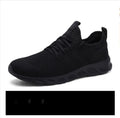 Men's black and white breathable mesh sneakers with round toe and lace-up closure for casual sports