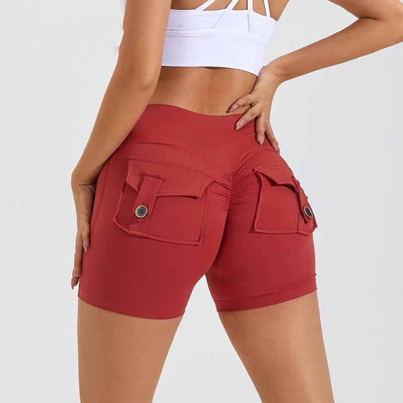 Women's high-waist fitness shorts in quick-dry nylon with side pockets, shown in Electric Blue.