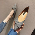 Red and black women's pointed toe casual shoes with a low flat heel on a white background.