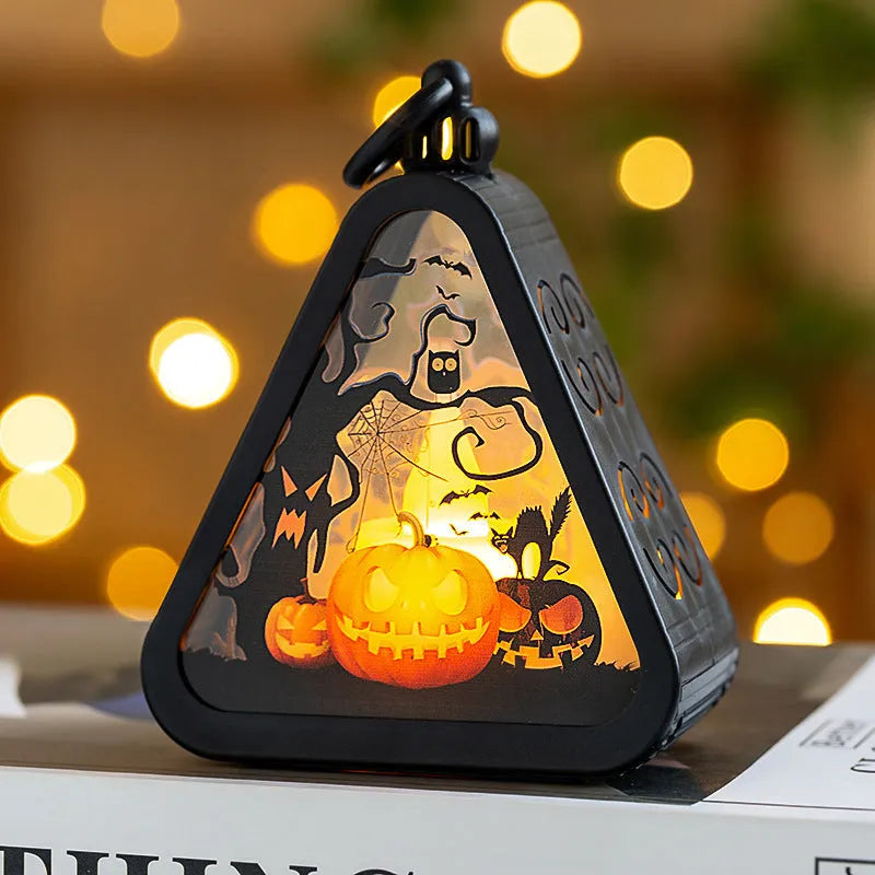 Portable Halloween pumpkin lamp decoration measuring 8.9cm with four colour designs